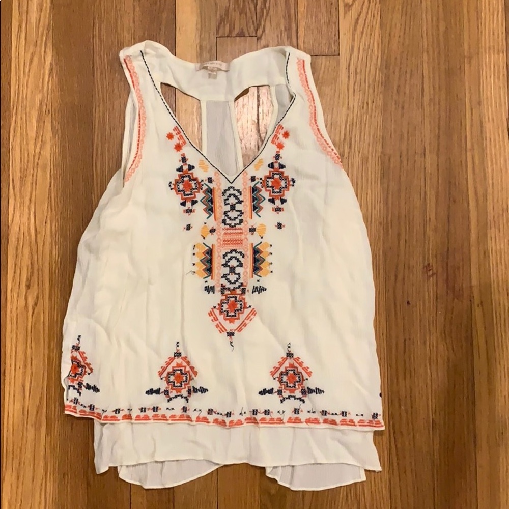 White stitched shirt.